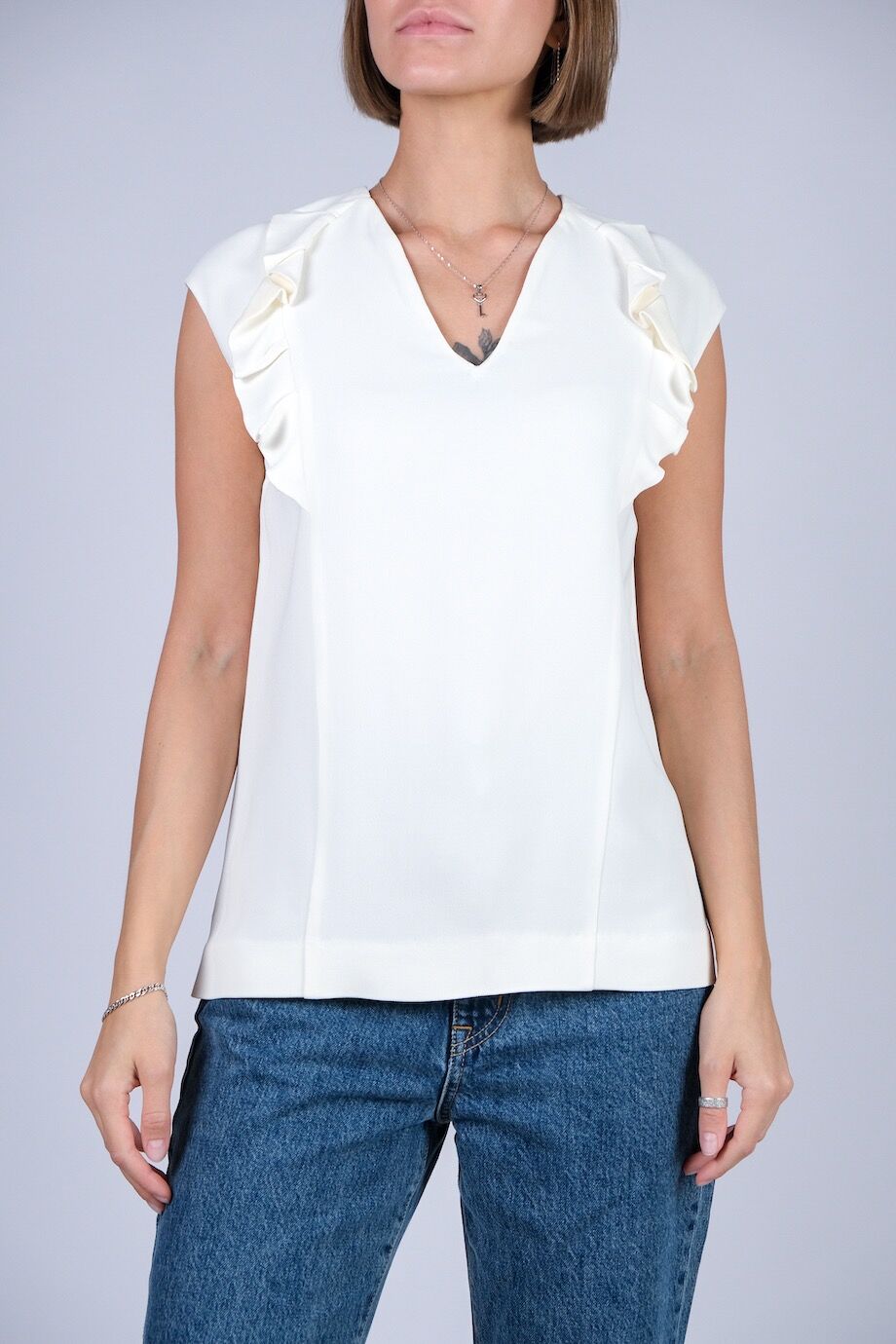 image 1 Блуза молочного цвета без рукавов с воланами
